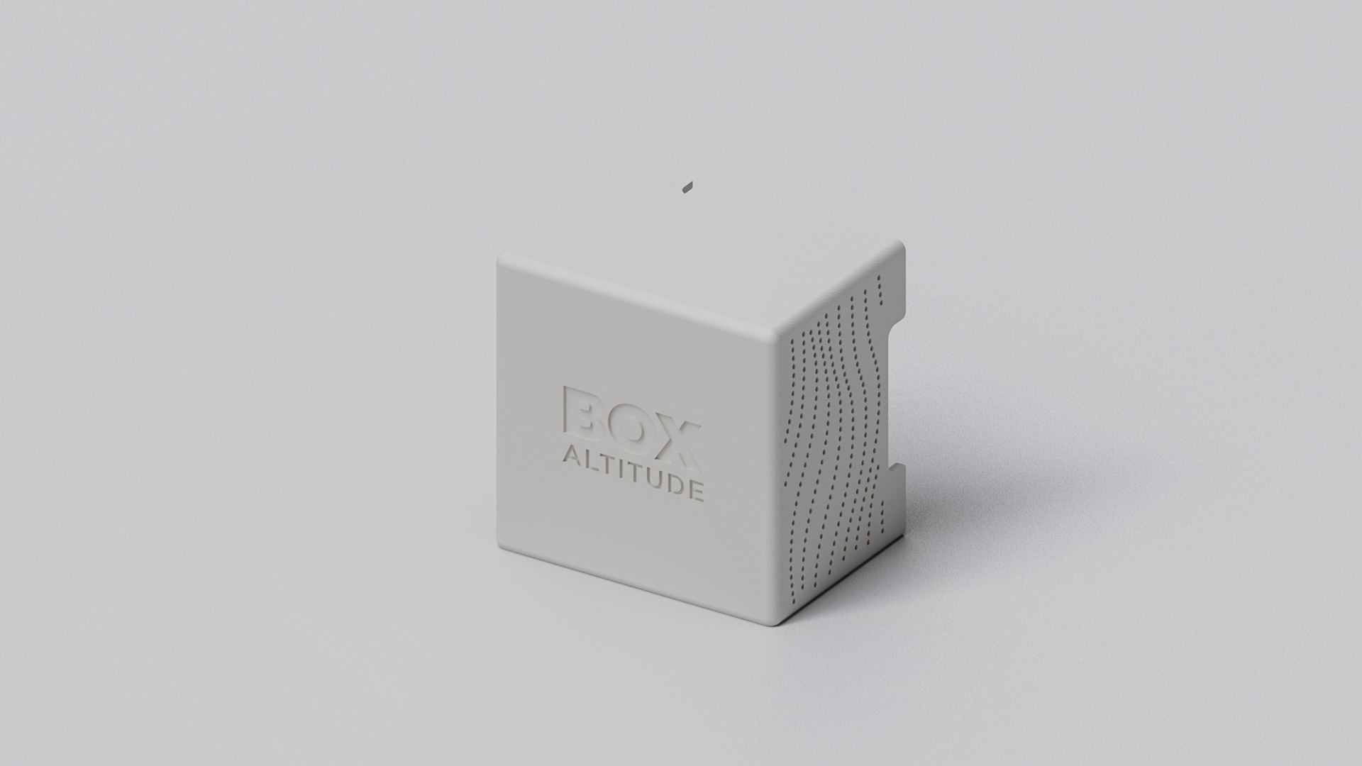 Off-white cube enclosure of the sensing unit, logo embossed on the front and wavy vent perforations along one side